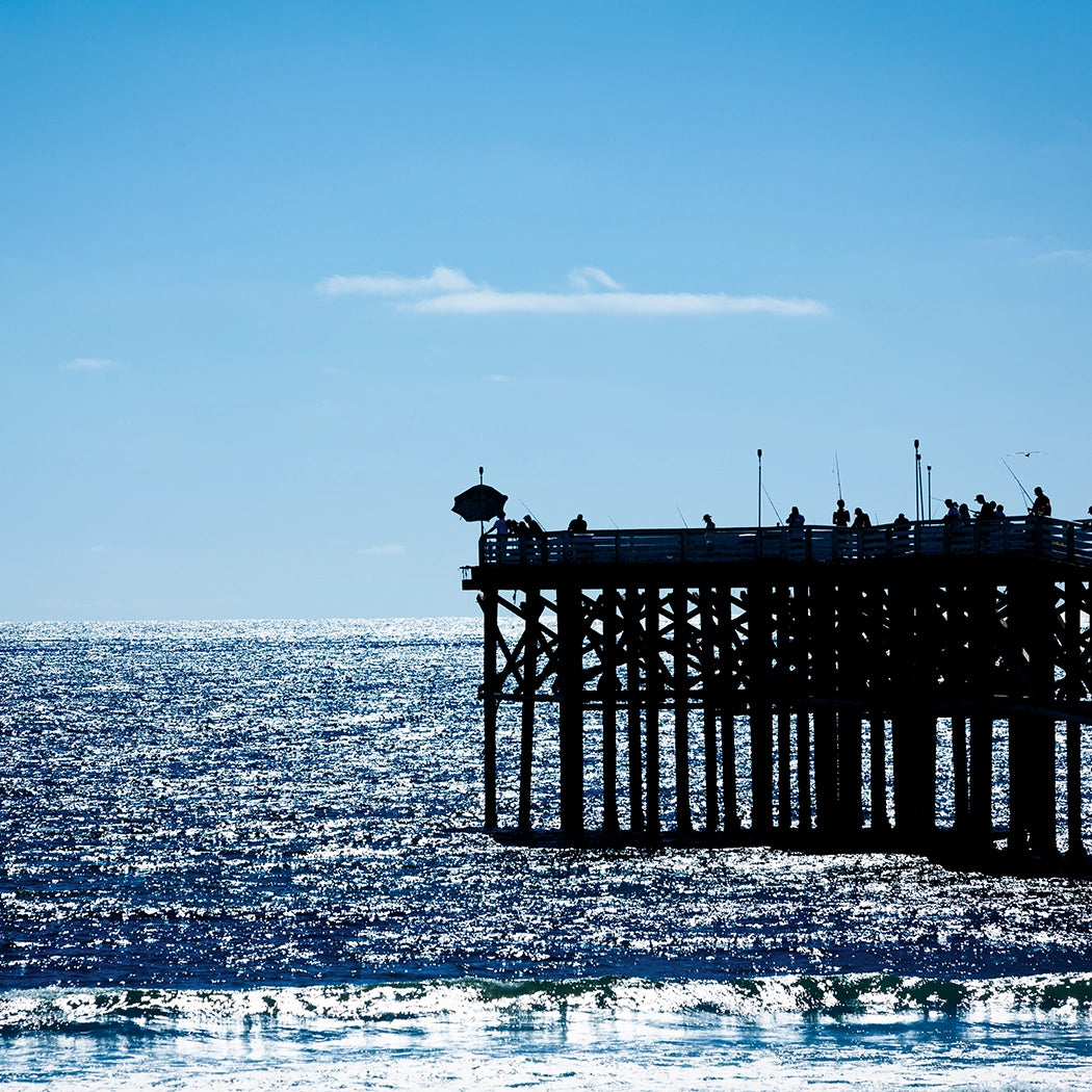 Thumbnail of Sunlit California Fishermen Pier and Shimmering Waves of the Pacific Ocean.