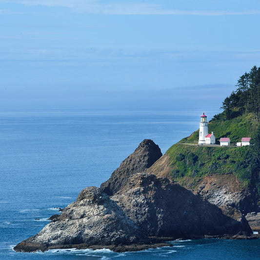 Thumbnail of the tranquil beauty of coastal the life in California with this stunning photograph of a solitary lighthouse perched atop a rugged cliff. Bathed in soft daylight and surrounded by the endless expanse of the deep blue Pacific Ocean.