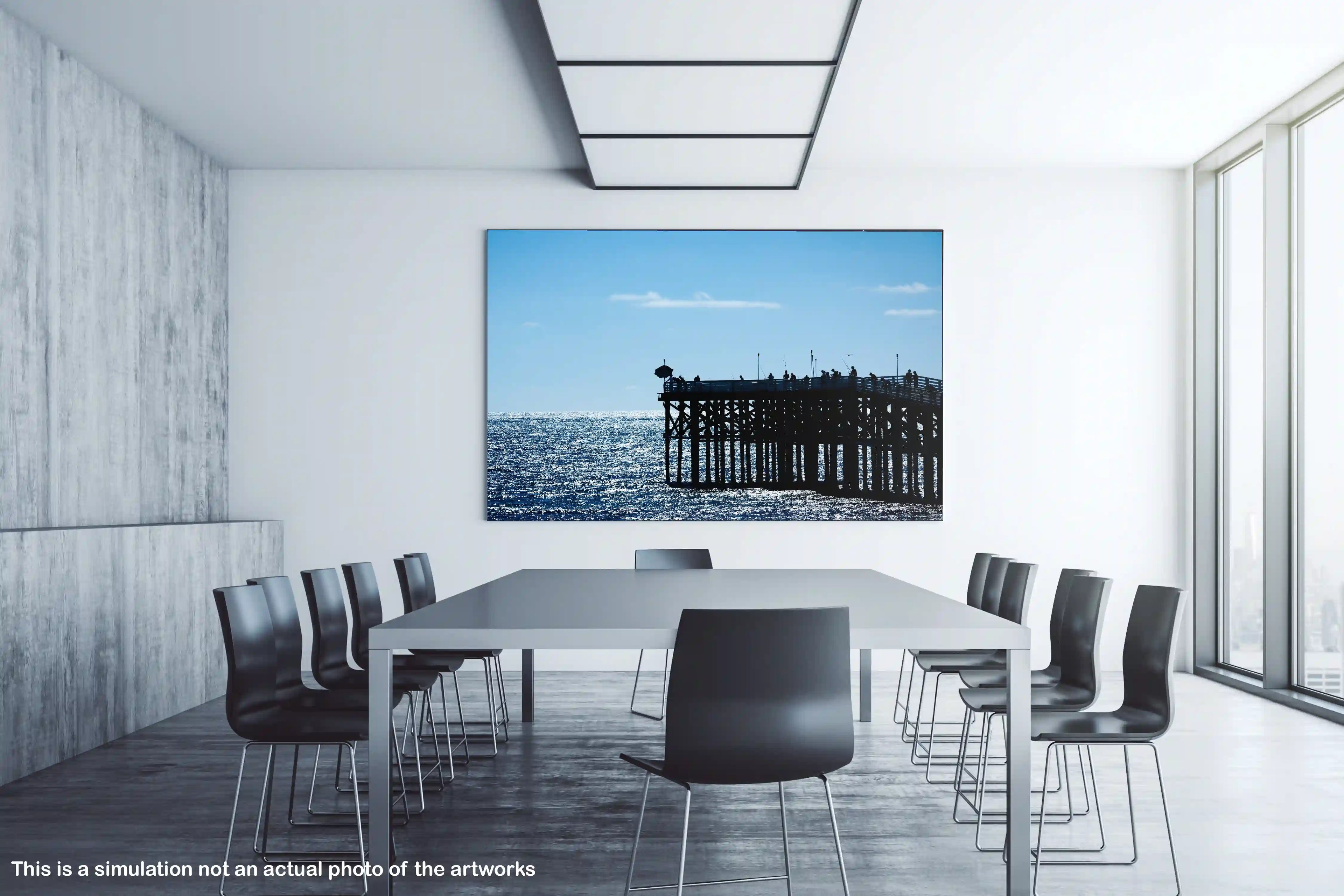 Modern conference room with a large screen displaying an artwork of a pier over water.