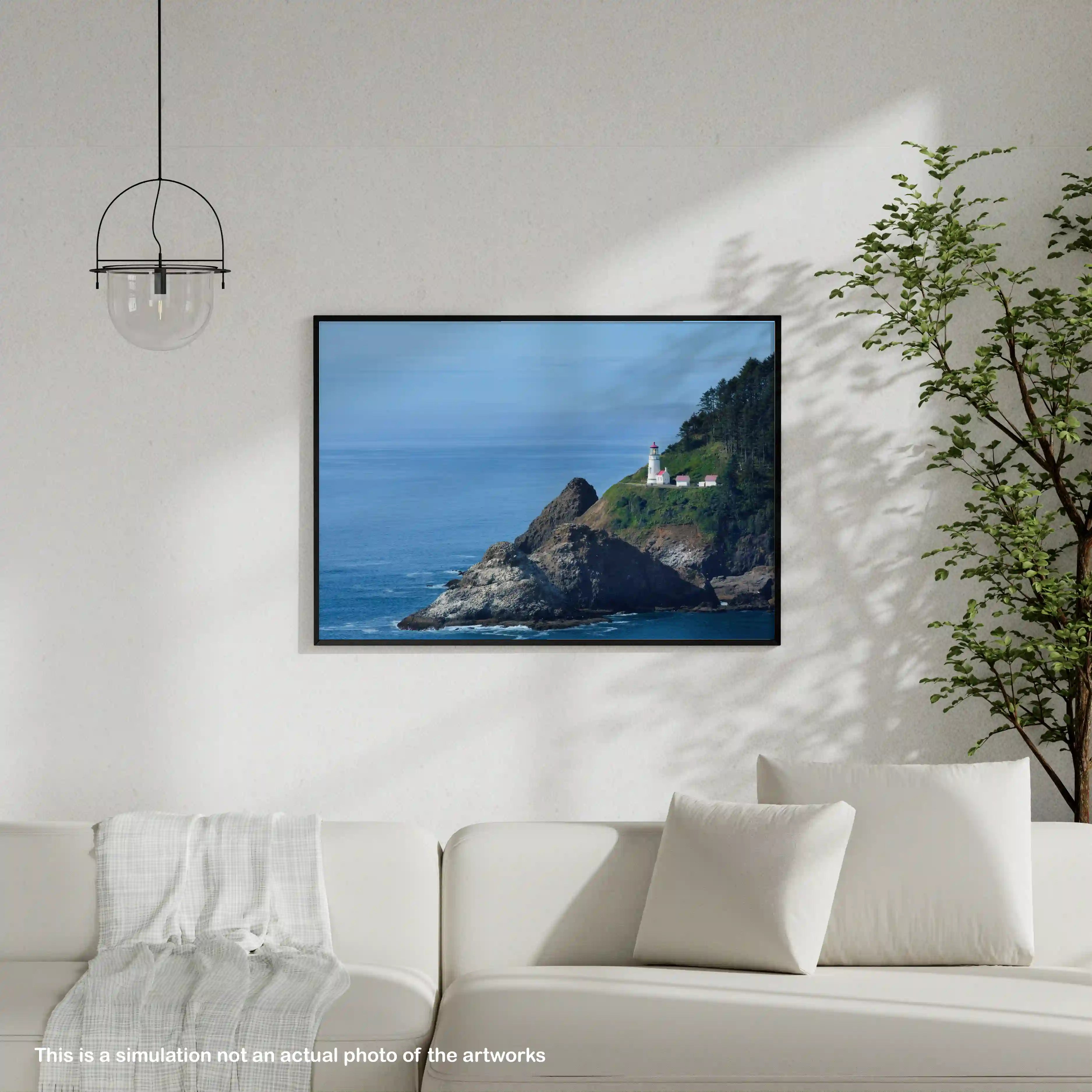 Framed artwork of a lighthouse on a cliff over the ocean in a living room setting.