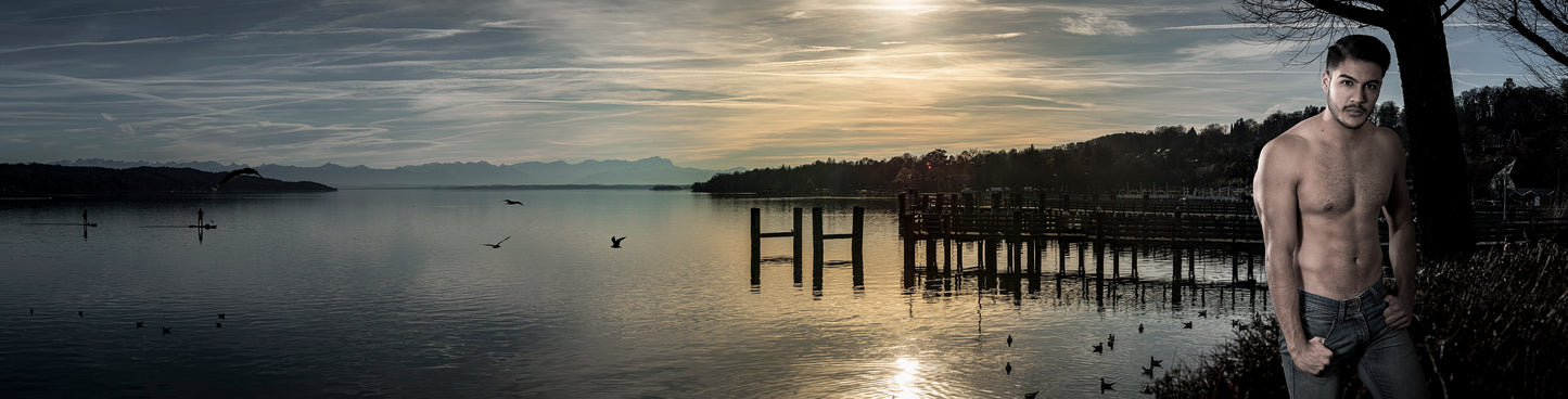 The serene beauty of a tranquil lakeside scene bathed in the fading light of dusk, paired with the poised presence of a man standing confidently at the water’s edge. Actual format of the artwork.