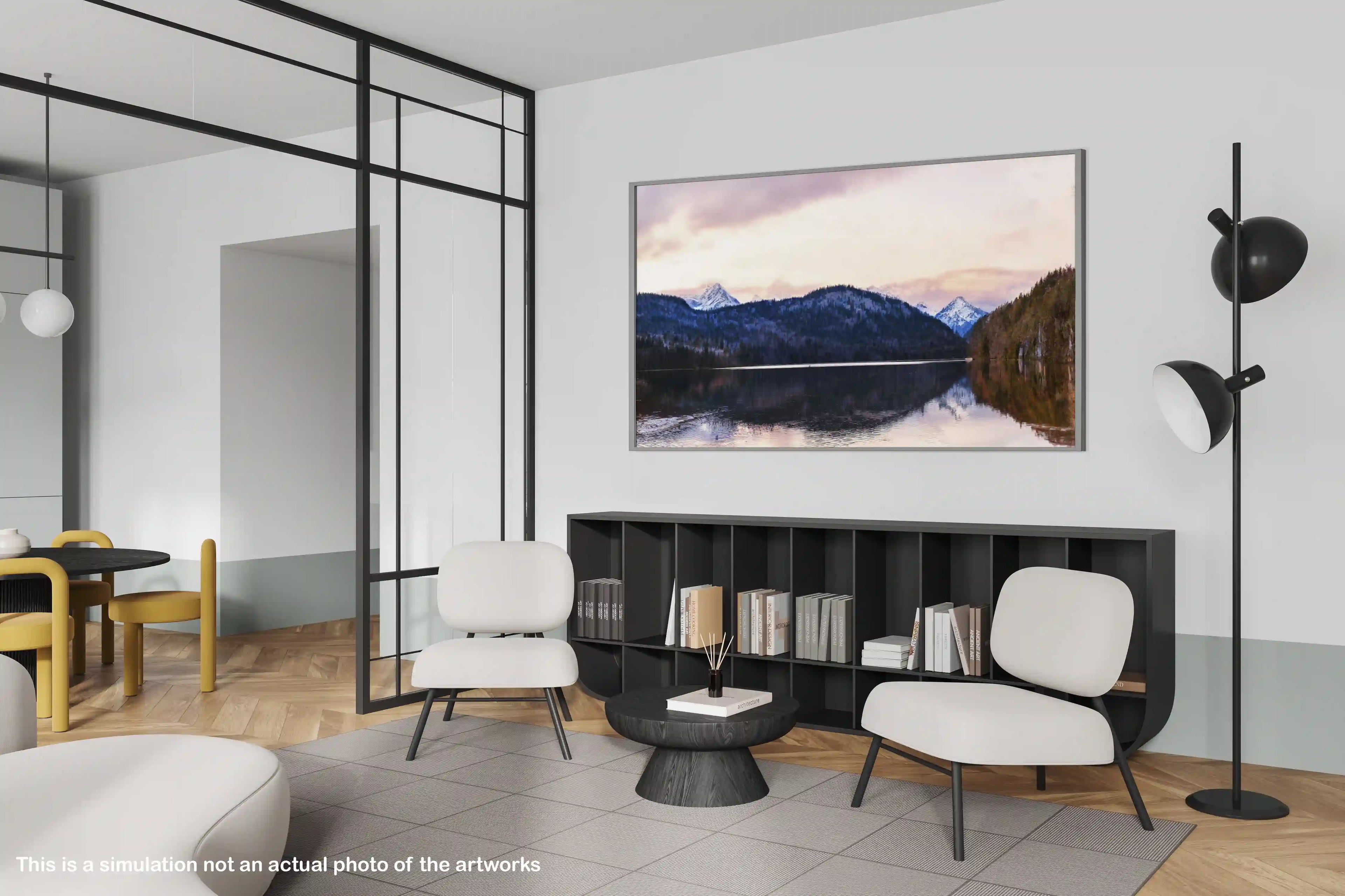 Modern living room with a large TV displaying a mountain scene, white chairs, and a black bookshelf.