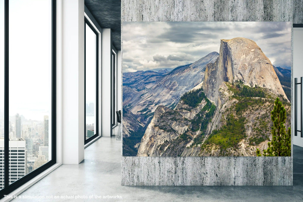Large wall art of a mountain landscape in a modern room with large windows.