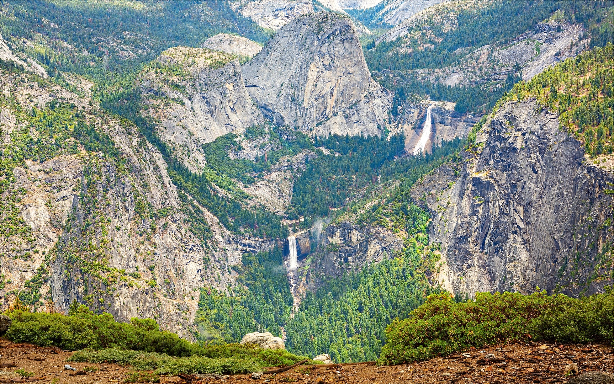 Scenic view of Yosemite Valley with waterfalls and mountains